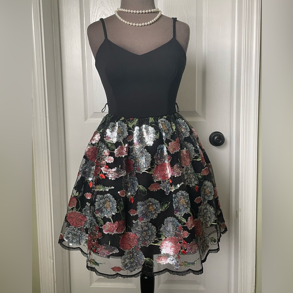 Black dress with sequin pattern skirt